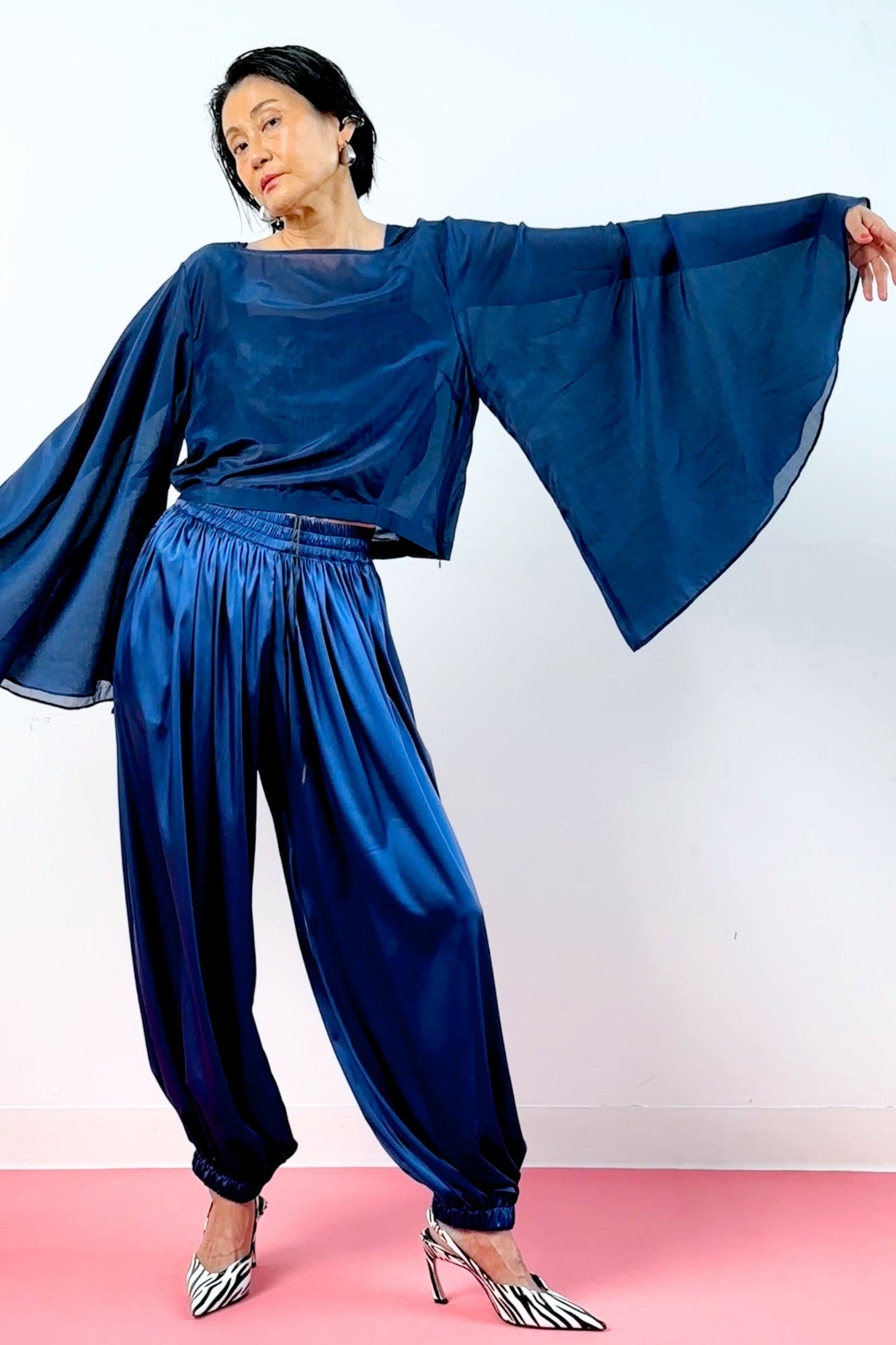 Navy blue semi-sheer silk pagoda sleeve top and wide-leg balloon pants – women's voluminous sheer sleeve bateau neck cropped blouson