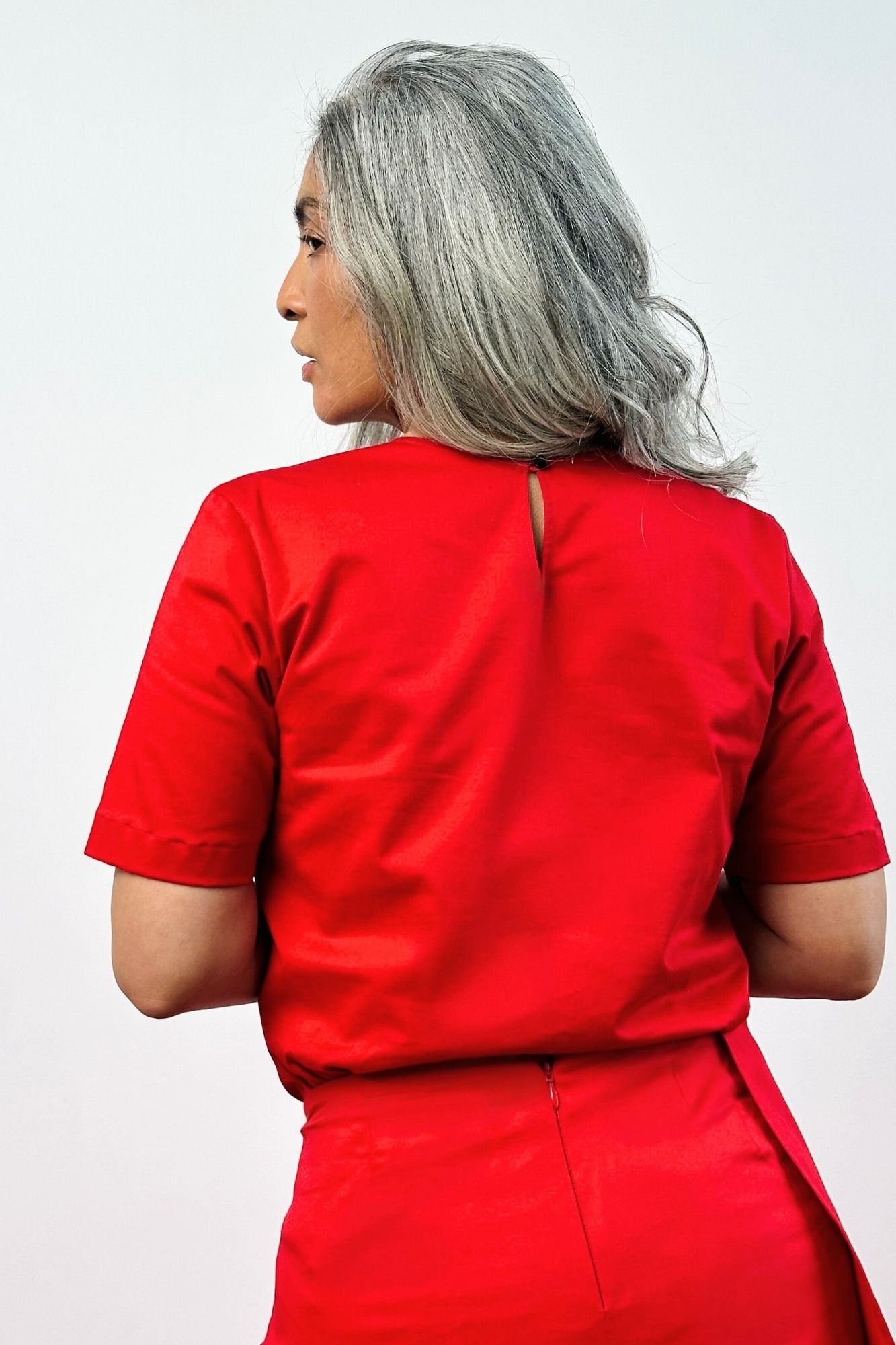 Rear view red square neck short sleeve top – women's keyhole back neck closure with side cut-outs and side slits