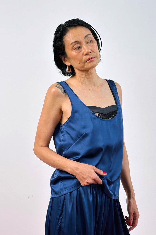 Navy blue silk low scoop neck tank top on model – women's sleeveless silk summer top